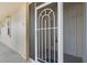 White front door with security screen at 101 N Marion Ct # 114, Punta Gorda, FL 33950