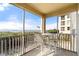 Screened lanai with ocean view and seating area at 101 N Marion Ct # 114, Punta Gorda, FL 33950