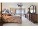 Main bedroom with large dresser and ocean view at 101 N Marion Ct # 114, Punta Gorda, FL 33950