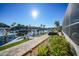 Canal-front patio with seating and lush landscaping at 1023 San Mateo Dr, Punta Gorda, FL 33950