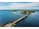 Aerial view of bridge and coastal community at 10320 Lands End Cir # 47, Placida, FL 33946