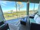 Serene balcony with outdoor seating, perfect for enjoying water views at 10320 Lands End Cir # 47, Placida, FL 33946