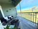 Relaxing balcony with water views and comfortable seating at 10320 Lands End Cir # 47, Placida, FL 33946