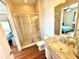 Bathroom with a walk-in shower, toilet and granite countertop vanity at 10320 Lands End Cir # 47, Placida, FL 33946