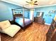 Primary bedroom with a king-size bed and light wood floors at 10320 Lands End Cir # 47, Placida, FL 33946