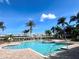 Relaxing pool area with surrounding lounge chairs at 10320 Lands End Cir # 47, Placida, FL 33946