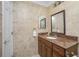 Neat bathroom with granite countertop and tiled walls at 109 Peckham Se St, Port Charlotte, FL 33952