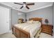 Well-lit bedroom with wood bed frame and gray walls at 109 Peckham Se St, Port Charlotte, FL 33952