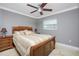 Comfortable bedroom with wood bed frame and gray walls at 109 Peckham Se St, Port Charlotte, FL 33952