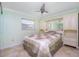 Bedroom with built-in shelving and ceiling fan at 109 Peckham Se St, Port Charlotte, FL 33952