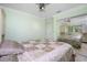 Serene bedroom with light green walls and a ceiling fan at 109 Peckham Se St, Port Charlotte, FL 33952