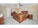 Spacious bedroom with mirrored closet doors and ceiling fan at 109 Peckham Se St, Port Charlotte, FL 33952