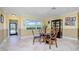 Dining area with glass table and view of entryway at 109 Peckham Se St, Port Charlotte, FL 33952