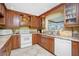 Spacious kitchen with granite countertops and wood cabinets at 109 Peckham Se St, Port Charlotte, FL 33952