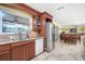 Bright kitchen with stainless steel appliances and granite counters at 109 Peckham Se St, Port Charlotte, FL 33952