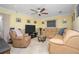 Relaxing living room featuring a large sectional sofa at 109 Peckham Se St, Port Charlotte, FL 33952