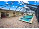 Enjoy this large screened in pool and spa, great for entertaining at 109 Peckham Se St, Port Charlotte, FL 33952