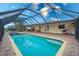 Enclosed pool and spa with water views at 109 Peckham Se St, Port Charlotte, FL 33952