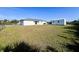 Large backyard with a storage shed and a home at 12143 & 12151 Dubarry Ave, Port Charlotte, FL 33981