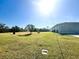 Backyard with partial view of home and trees at 12143 & 12151 Dubarry Ave, Port Charlotte, FL 33981