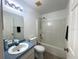 Bathroom with tub and shower at 12143 & 12151 Dubarry Ave, Port Charlotte, FL 33981