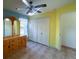 Bedroom with double door closet and tiled floor at 12143 & 12151 Dubarry Ave, Port Charlotte, FL 33981