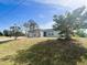 Single story home with front yard and landscaping at 12143 & 12151 Dubarry Ave, Port Charlotte, FL 33981