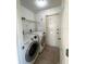 Laundry room with washer, dryer and exterior access at 12143 & 12151 Dubarry Ave, Port Charlotte, FL 33981