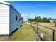 Side view of a white storage shed and fence at 12143 & 12151 Dubarry Ave, Port Charlotte, FL 33981