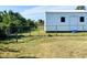 White metal storage shed with chain link fence at 12143 & 12151 Dubarry Ave, Port Charlotte, FL 33981