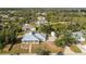 Aerial view of a single-Gathering home with a large backyard and surrounding neighborhood at 13204 Kakapo Ave, Port Charlotte, FL 33981