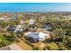 Aerial view of a single-story home with a screened porch at 13204 Kakapo Ave, Port Charlotte, FL 33981