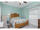 Bedroom with wooden bed frame and window seat at 13204 Kakapo Ave, Port Charlotte, FL 33981