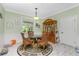 Charming dining area with glass-top table and four wicker chairs at 13204 Kakapo Ave, Port Charlotte, FL 33981