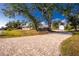 Long paver driveway leading to the house and detached garage at 13204 Kakapo Ave, Port Charlotte, FL 33981