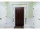 Elegant entryway with a dark wood door and sidelights at 13204 Kakapo Ave, Port Charlotte, FL 33981