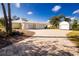 House exterior featuring a three-car garage and paver driveway at 13204 Kakapo Ave, Port Charlotte, FL 33981