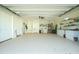 Large garage with ample storage and workshop space at 13204 Kakapo Ave, Port Charlotte, FL 33981