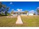 House exterior view showcasing front porch and walkway at 13204 Kakapo Ave, Port Charlotte, FL 33981