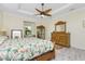 Spacious main bedroom with king bed, dresser, and ceiling fan at 13204 Kakapo Ave, Port Charlotte, FL 33981