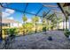 Screened patio with pavers and backyard views at 13204 Kakapo Ave, Port Charlotte, FL 33981