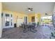 Large screened porch with paver patio and ceiling fan at 13204 Kakapo Ave, Port Charlotte, FL 33981