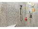 Spa-like shower with pebble tile and built-in seat at 13204 Kakapo Ave, Port Charlotte, FL 33981