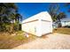 Detached workshop with a roll-up garage door at 13204 Kakapo Ave, Port Charlotte, FL 33981