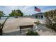 Waterfront backyard with bench and bird bath at 1350 Aqua View Ln, Englewood, FL 34223