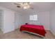 Bedroom with king-size bed, ceiling fan, and closet at 1350 Aqua View Ln, Englewood, FL 34223