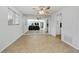 Dining room with mirrored wall reflecting living area at 1350 Aqua View Ln, Englewood, FL 34223