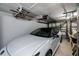 Garage with car and overhead storage for fishing gear at 1350 Aqua View Ln, Englewood, FL 34223