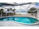 Relaxing screened-in pool with beautiful waterfront views at 1350 Aqua View Ln, Englewood, FL 34223