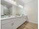 Double vanity bathroom with white cabinets and marble countertops at 13707 Begonia Cir, Port Charlotte, FL 33981